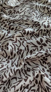 Abstract beige and brown print - fabric close-up