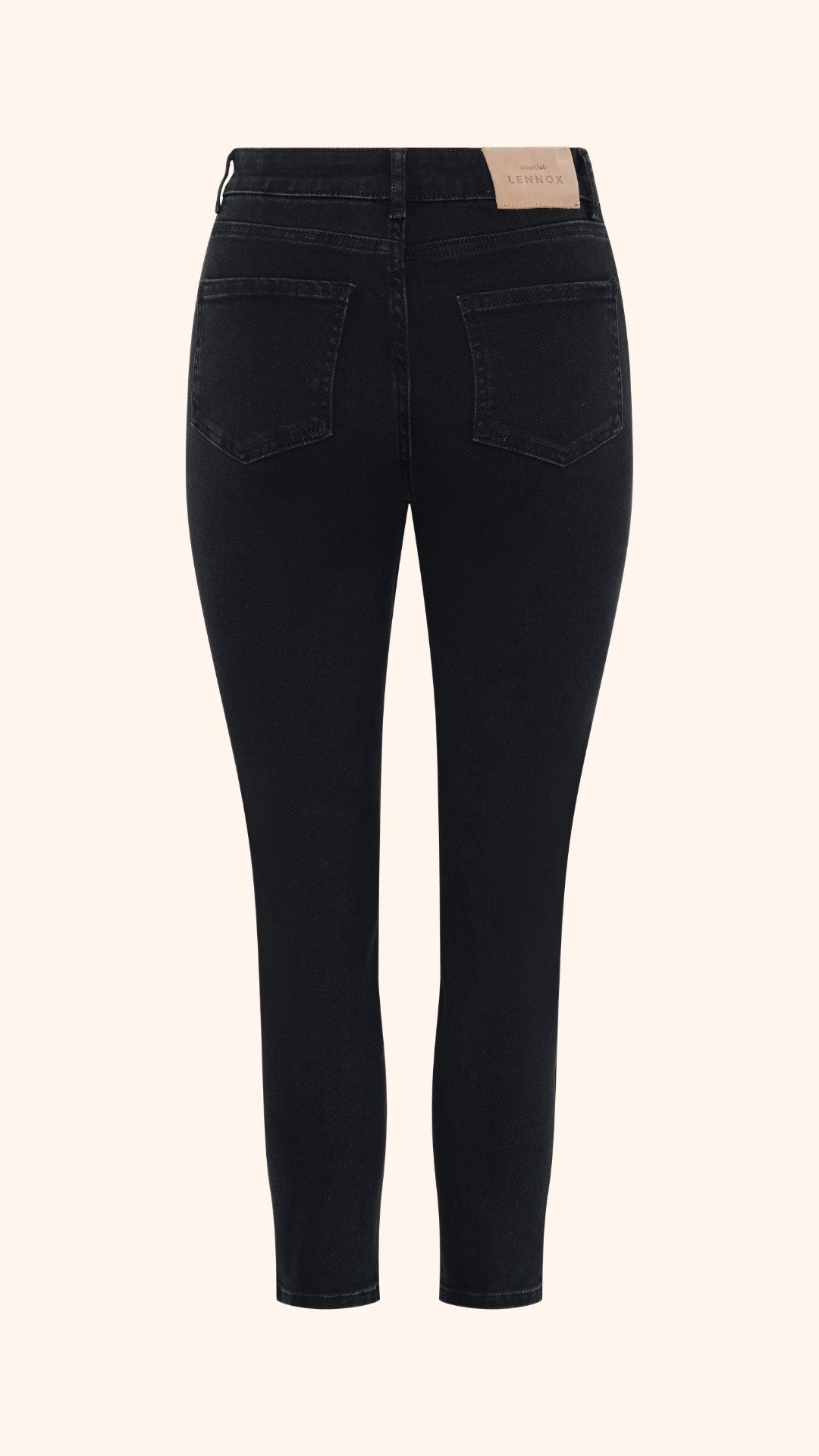 Slim, straight, high rise black petite jeans, back view