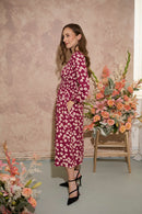 Women's petite autumn smocked midi dress with modern poppy print on a plum base