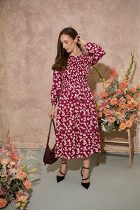 Women's petite autumn smocked midi dress with modern poppy print on a plum base