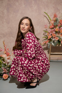 Women's petite autumn smocked midi dress with modern poppy print on a plum base