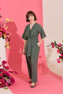 Wide leg, short sleeve petite jumpsuit in green, worn by model