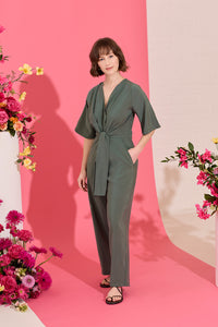 Wide leg, short sleeve petite jumpsuit in green, worn by model