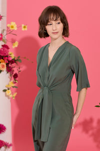 Wide leg, short sleeve petite jumpsuit in green, worn by model close up