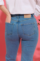 Slim, straight, high rise blue petite jeans, back view close up