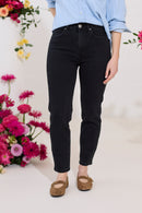 Slim, straight, high rise black petite jeans close up front view