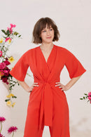 Wide leg, short sleeve petite jumpsuit in red, worn by model close up front view