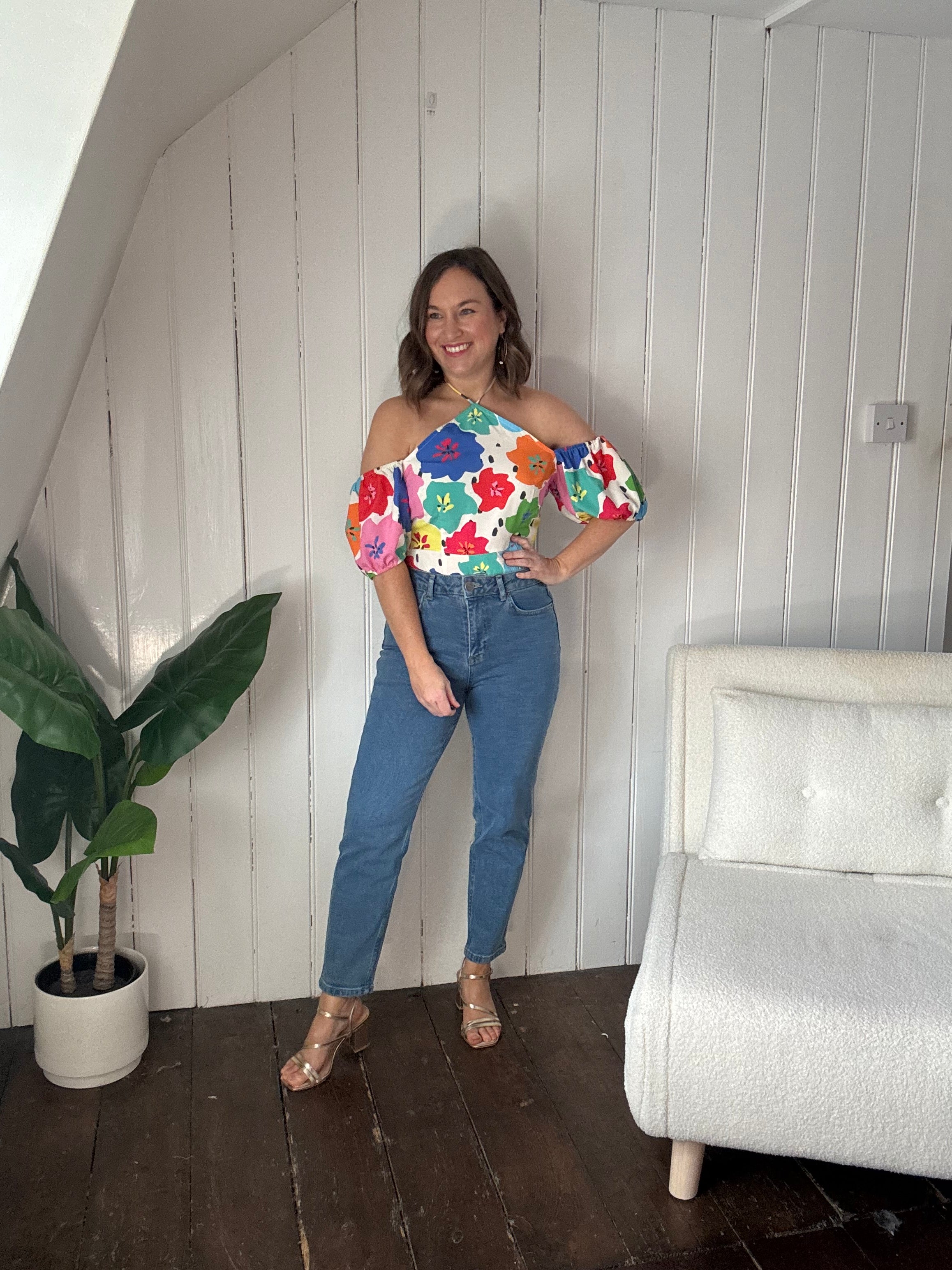 Size 12 model wearing black petite jeans styled casually